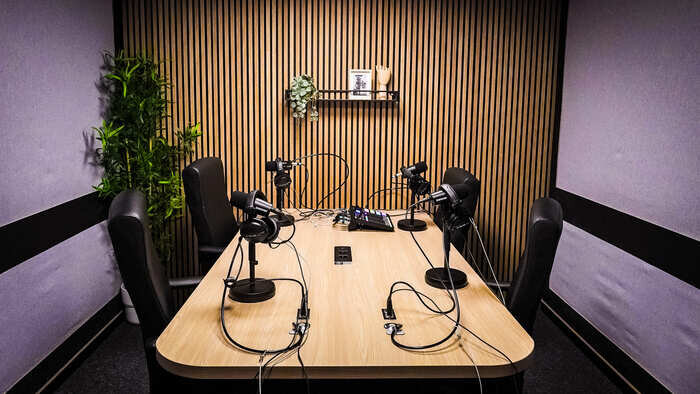 Modern podcast studio with professional microphones